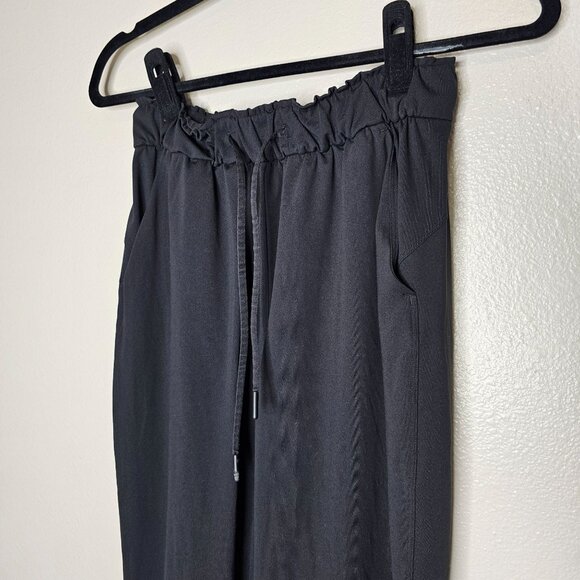 Lululemon Size 4 Black Keep Moving Pant 7/8 High Rise Relaxed Fit Sweat Wicking - Picture 3 of 10